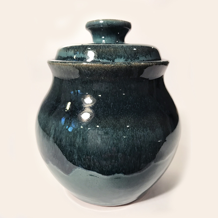 Item 323<br>Blue-glazed brown stoneware lidded pot, 4.75 in x 3.75 in wide.<br><b>$60</b>