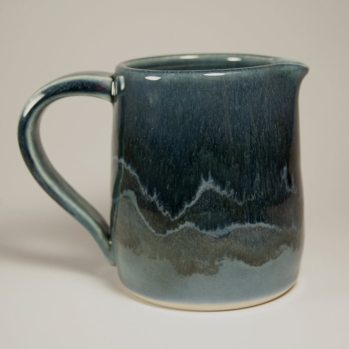 Item 423<br>Small blue-glazed white stoneware pitcher. 3.75 in tall x 3.25 in wide. Good for creams or sauces.<br>