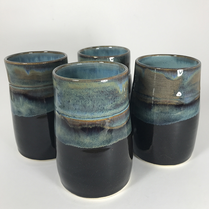 Item 705<br>Black with Blue Glazed Tumblers, 4.75 in tall x 3.0 in wide<br><b>Sold</b>