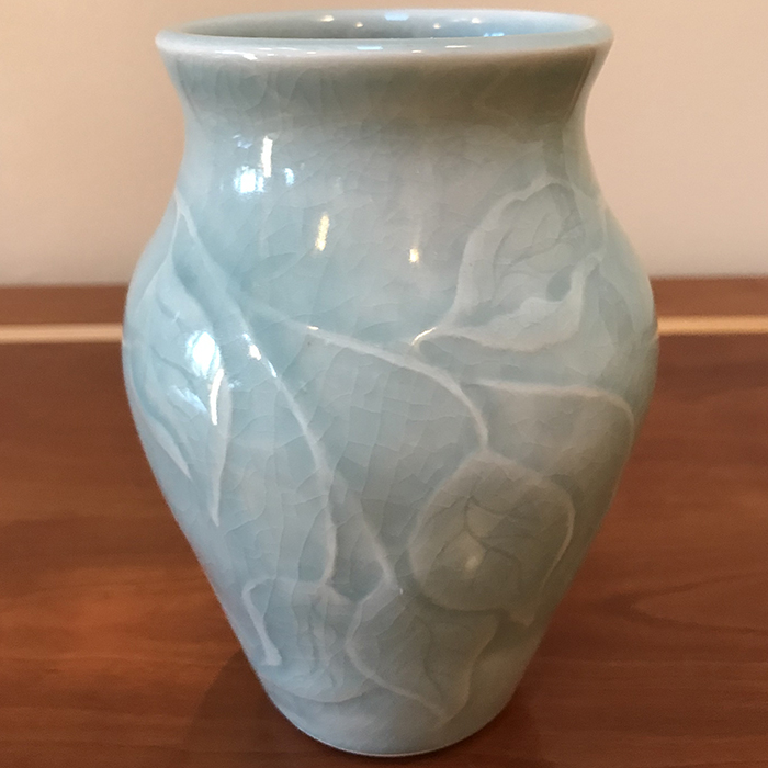 Item 118<br>Porcelain vase with carved leaves in an aqua celadon glaze<br>5.25 in tall x 3.5 in wide<br>