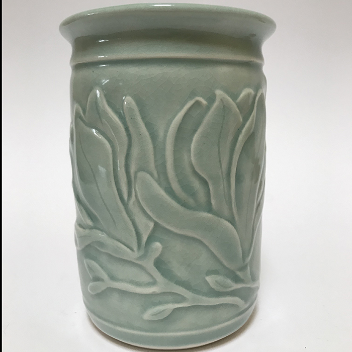 Item 122<br>Porcelain vase with carved magnolia flowers in an aqua celadon glaze<br>5.0 in tall x 3.75 in wide<br><b>Sold</b>