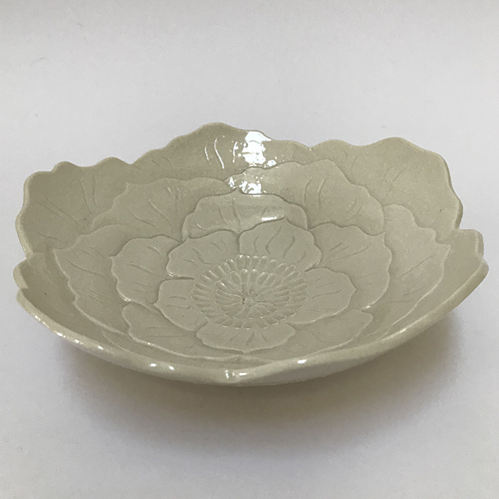 Item 277<br>Porcelain dish with carved flower in a clear glaze<br>2.0 in tall x 6.25 in wide<br><b>Sold</b>