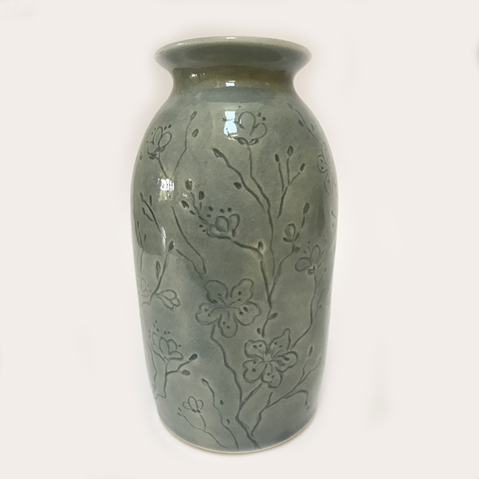 Item 281<br>Porcelain vase with carved cherry blossoms in a gray celadon glaze<br>5.5 in tall x 3.0 in wide<br><b></bSold>