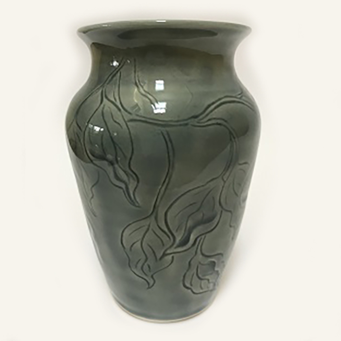 Item 491<br>White stoneware vase with carved leaves in a gray celadon glaze<br>6.25 in tall x 4.0 in wide<br><b>$65</b>