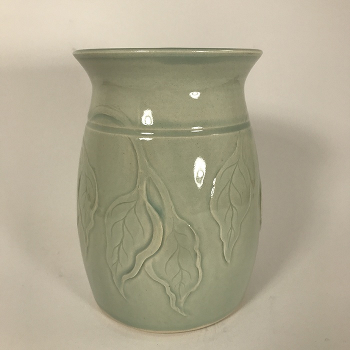 Item 680<br>Carved vase with generic leaves, 5.75 inches tall x 3.75 inches in diameter<br><b>$120</b>