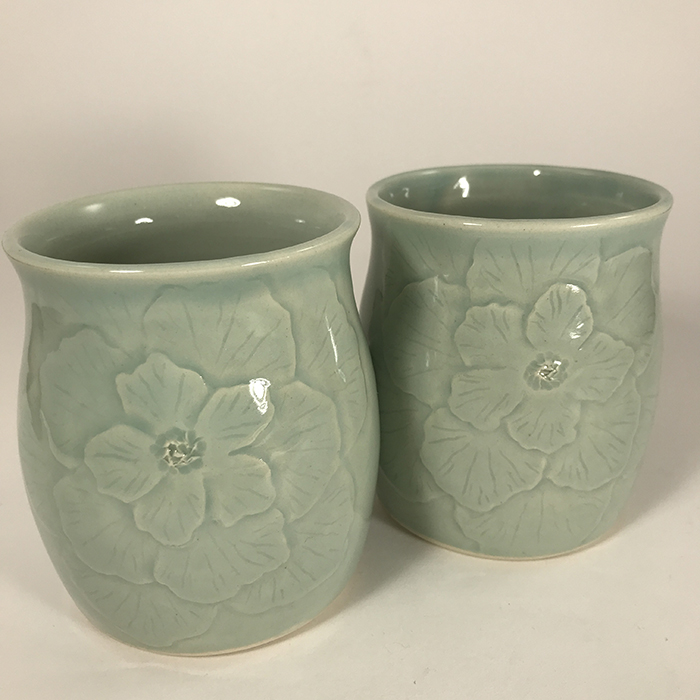 Item 706<br>Two carved flowers tumblers, 3.75 inches tall x 3 inches in diameter<br><b>$40 each</b>