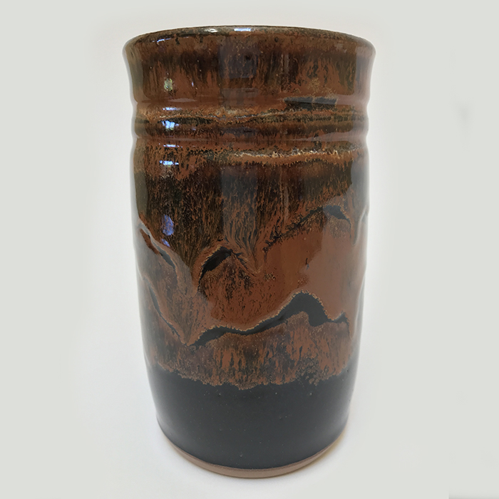 Item 465<br>Red/Black Glazed Pot, 5.25 in tall x 3.0 in wide. Can be used as a flower vase or to hold artist brushes, make-up brushes, or tooth brushes.<br><b>Sold</b>