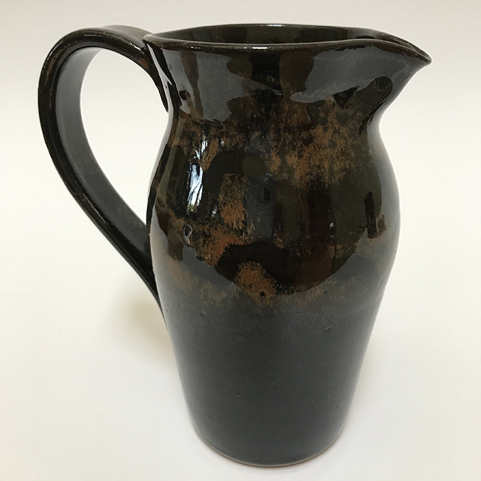Item 469<br>Red/Black Glazed Pitcher, 6.25 in tall x 3.25 in wide. Holds about 18 oz.<br><b>$35</b>