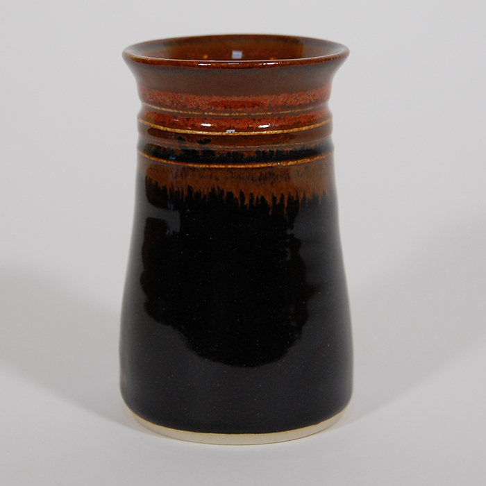 Item 526<br>Red/Black Glazed Bud Vase on white stoneware, 3.25 in tall x 2.25 in wide<br><b>Sold</b>