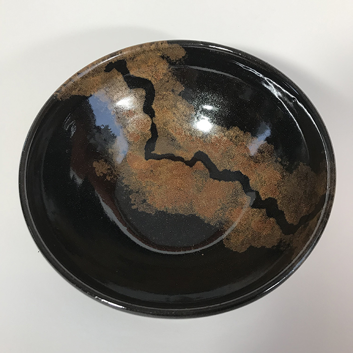 Item 577<br>Black and copper glazed brown stoneware bowl, 2.75 in tall x 7.25 in wide<br><b>Sold</b>
