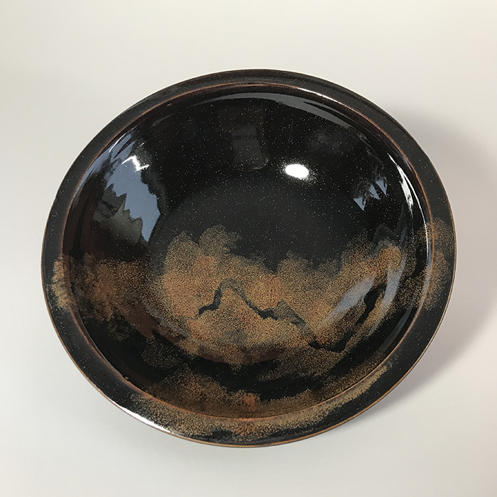 Item 578<br>Black and copper glazed white stoneware bowl, 2.25 in tall x 8.5 in wide<br><b>Sold</b>