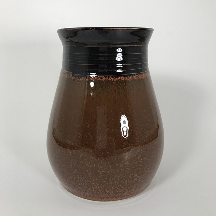 Item 678<br>Black and copper-glazed vase, 6 inches tall x 4.5 inches in diameter<br><b>$40</b>