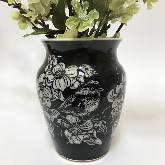 Item 104<br>Black sgraffito vase with carved dogwood flowers and chickadees<br>6.25 in tall x 4.75 in wide.<br>Not for Sale