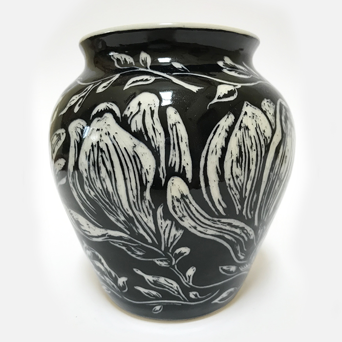 Item 105<br>Black sgraffito vase with carved magnolia flowers<br>4.75 in tall x 4.5 in wide<br><b>Sold</b>
