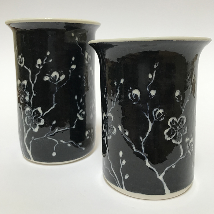 Item 280<br>Black sgraffito tumblers with carved cherry blossoms<br>4.75 in tall x 3.25in wide<br><b>Sold</b>