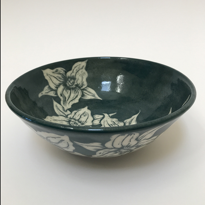 Item 477<br>Dark green sgraffito bowl with carved trillium flowers on white stoneware<br>2.5 in tall x 7.0 in wide<br><b>Sold</b>