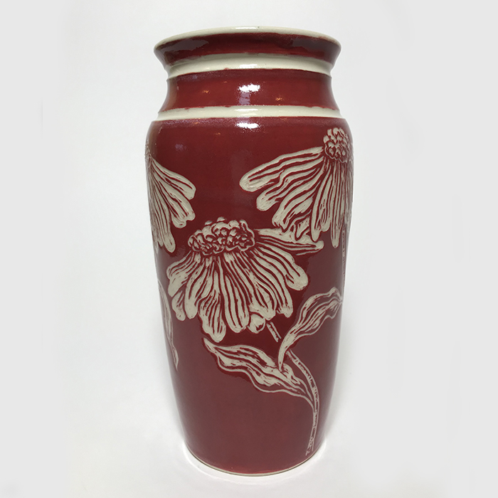 Item 513<br>Red sgraffito vase on white stoneware with carved cone flowers<br>7.5 in tall x 3.25 in wide<br><b>Sold</b>