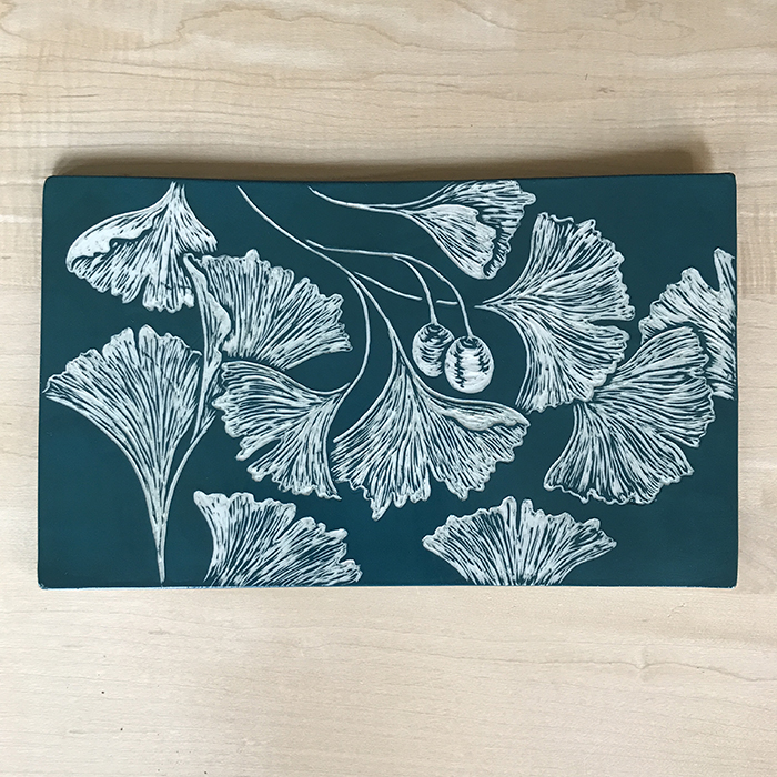 Item 611<br>Green sgraffito tile with ginko leaves<br>9.0 in tall x 7.5 in wide