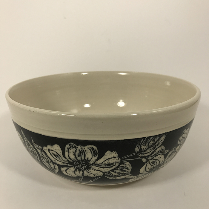 Item 642a<br>Deep white stoneware bowl with black sgraffito band on outside with carved dogwood flowers and leaves<br>3.25 in tall x 7.75 in wide<br><b>Sold</b>