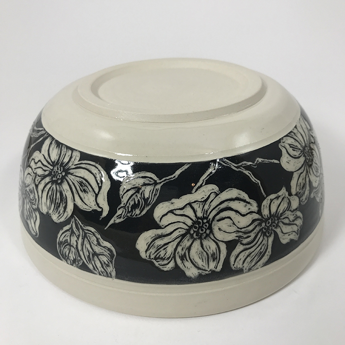 Item 642b<br>Deep white stoneware bowl with black sgraffito band on outside with carved dogwood flowers and leaves<br>3.25 in tall x 7.75 in wide<br><b>Sold</b>