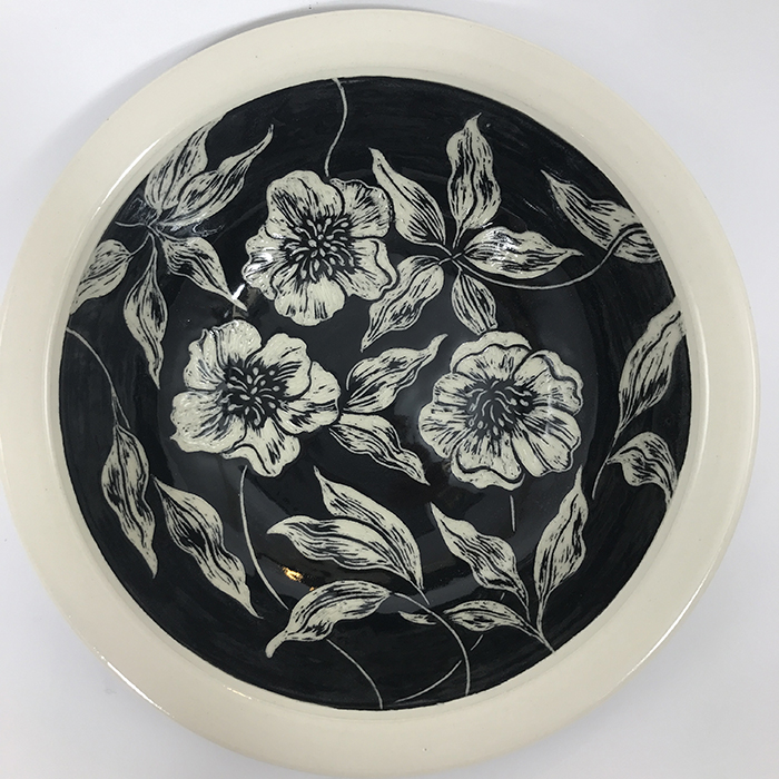 Item 644<br>Black sgraffito bowl on white stoneware with carved lenten rose flowers and leaves<br>2.25 in tall x 8.25 in wide<br><b>$125</b>