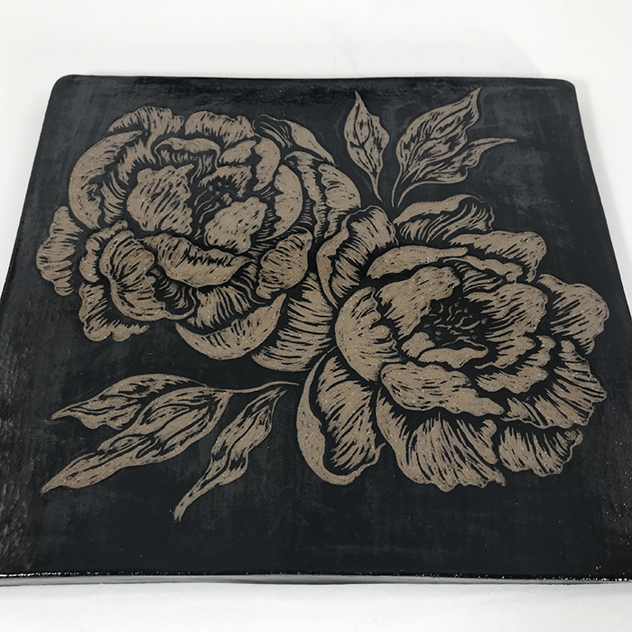 Item 695<br>Black sgraffito tile with peonies<br>7.0 in x 7.75 in