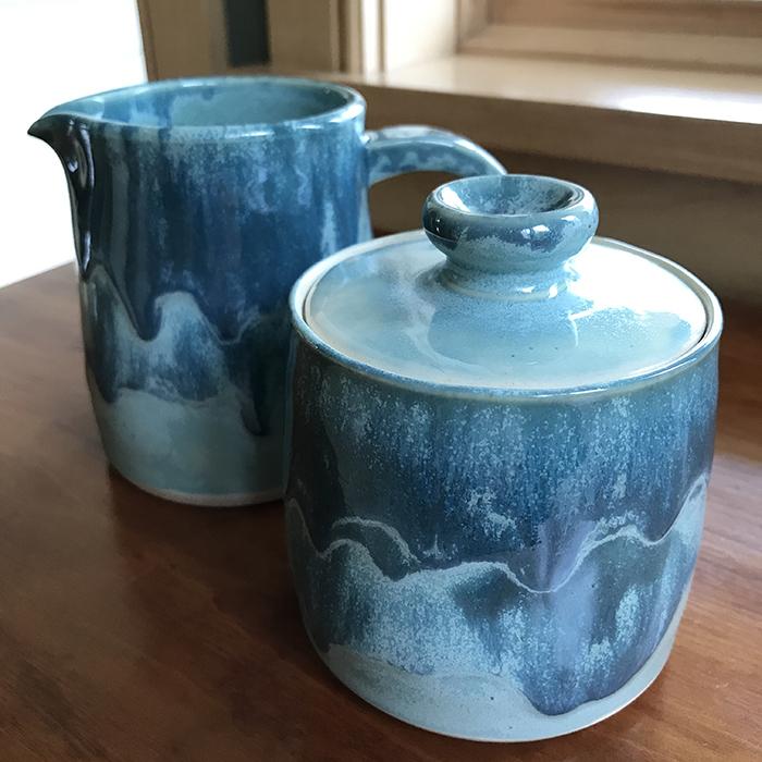 Item 427<br>Turquoise Cream and Sugar Set, 5.0 in tall x 3.0 in wide.<br><b>$30</b>