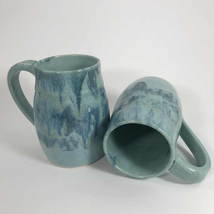 Item 593a and 593b<br>Large turquoise glazed white stoneware mugs<br>5 in tall x 3.25 in wide<br><b>Sold</b>